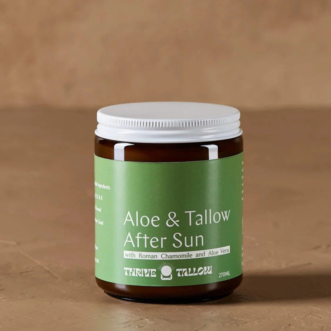 Aloe & Tallow After Sun Balm - 270ml in a brown jar with green label by Thrive Tallow on a neutral background