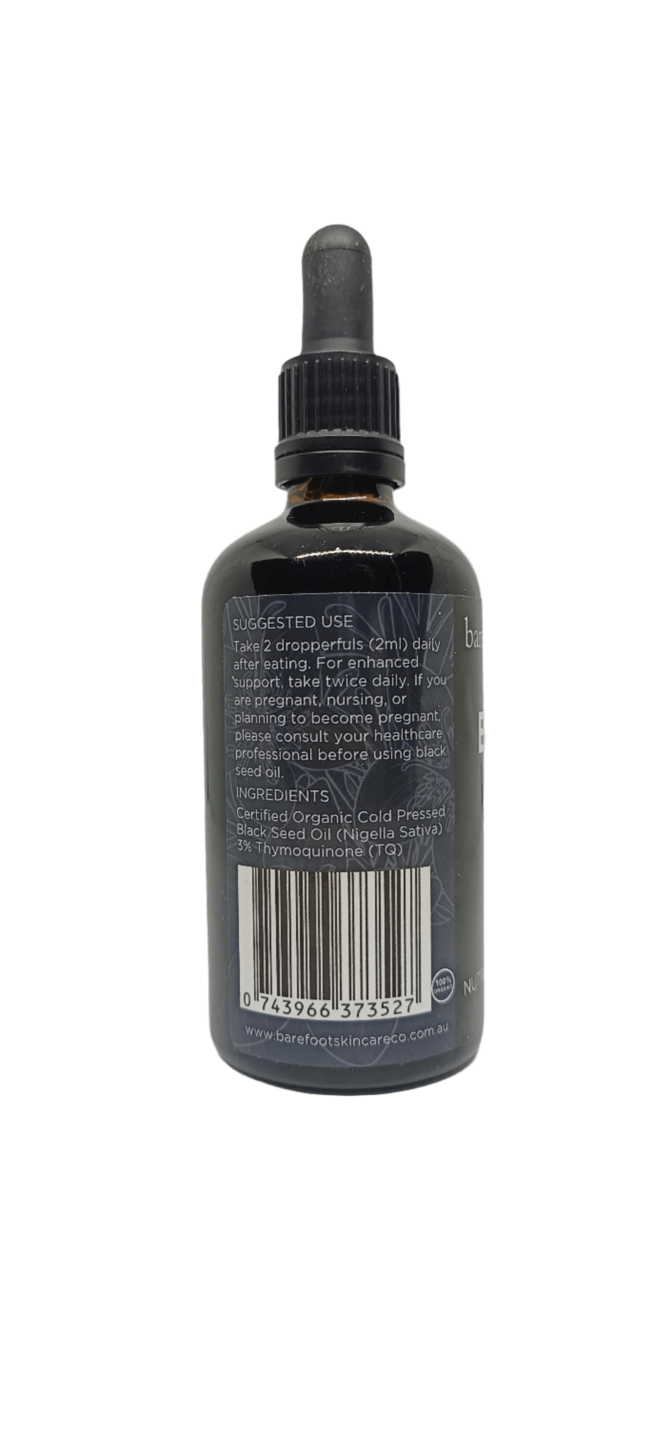 Back label of Black Seed Oil - 100ml with usage instructions, ingredients, barcode, and Barefoot Skincare Co branding in dark glass bottle