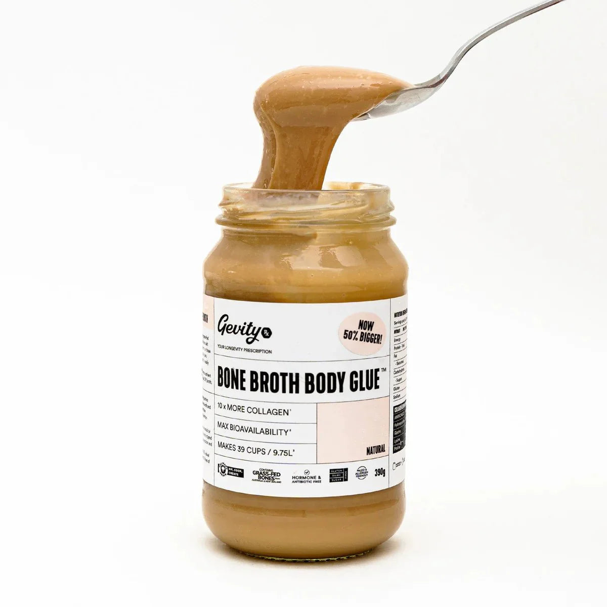 Jar of Bone Broth Body Glue - Natural - 390g by Gevity Rx with spoon lifting thick broth against white background