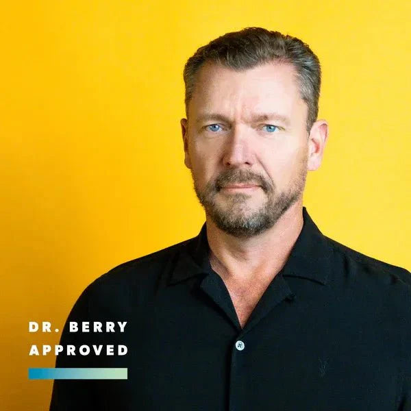 Man in black shirt against yellow backdrop with text "Dr. Berry Approved" endorsing Daily Minerals - 946ml product.