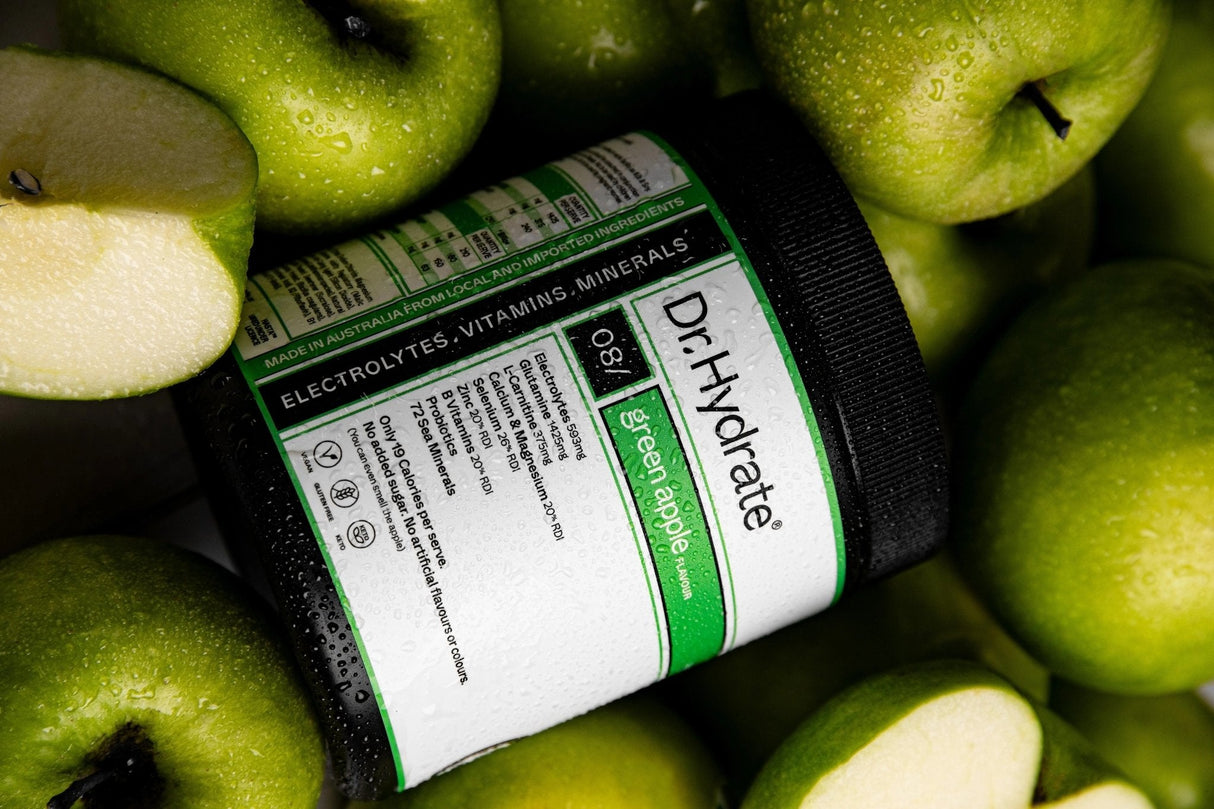 Green Apple Jar - 30 Serves by Dr. Hydrate surrounded by fresh green apples highlighting electrolytes and vitamins.