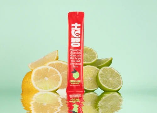 Hyro Single Stick hydrating electrolyte drink mix with lemon and lime flavor, surrounded by citrus slices.