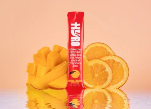 Hyro Single Stick electrolyte drink mix with sliced orange and mango, supporting low carb and functional hydration.