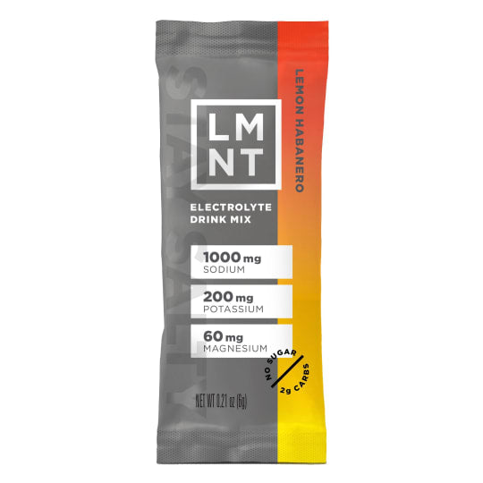 LMNT electrolyte drink mix single stick in light mango flavor with gray, orange, and yellow gradient packaging.
