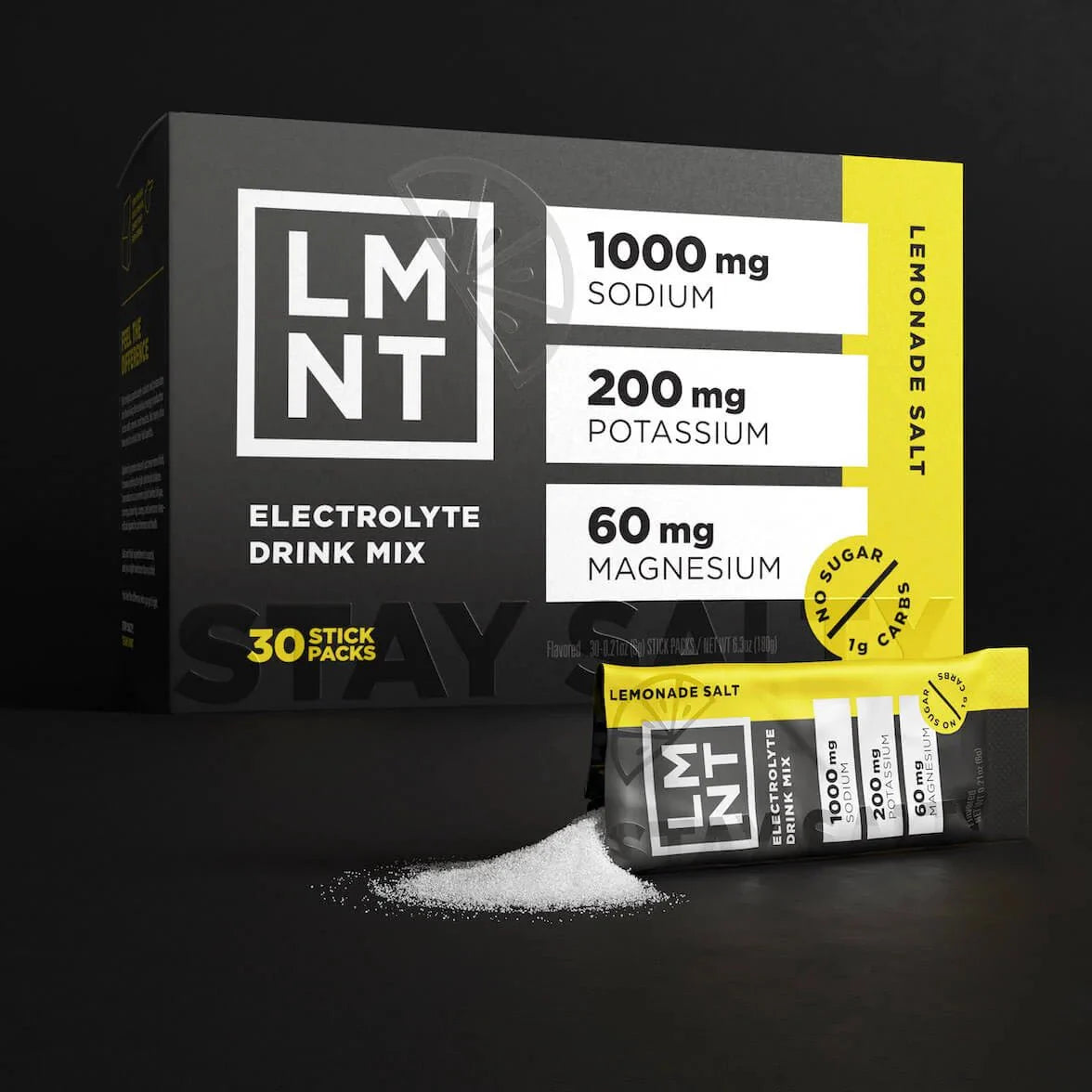 Black and yellow LMNT Lemonade Salt Electrolyte Drink Mix box with open stick pack and spilled powder on black background