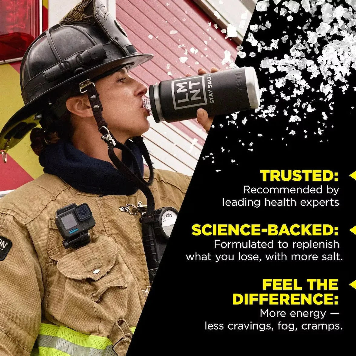 Firefighter in gear drinking from a black LMNT Lemonade Salt Electrolyte Mix - 30 Sticks container, highlighting hydration and electrolyte benefits by LMNT.