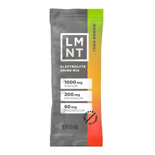 Single-use LMNT electrolyte drink mix stick in gray packaging with orange, yellow, and green gradient stripe labeled Mango.