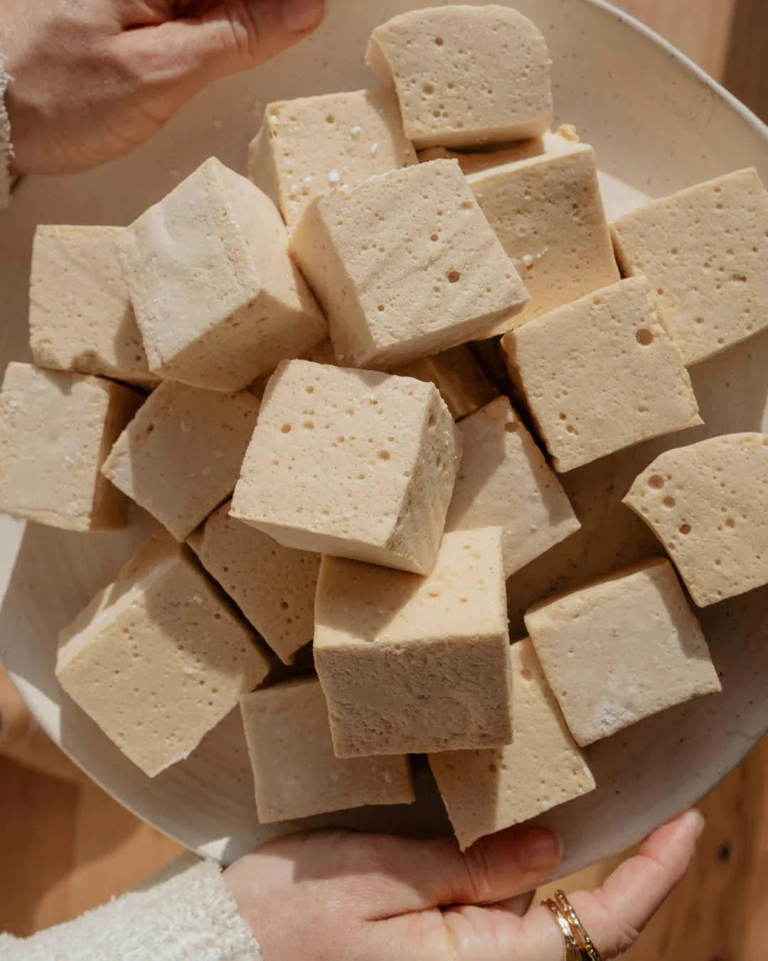 Natural Gelatin - 300g cubes held in hands, showcasing Nutra Organics product from pantry and low carb collections.