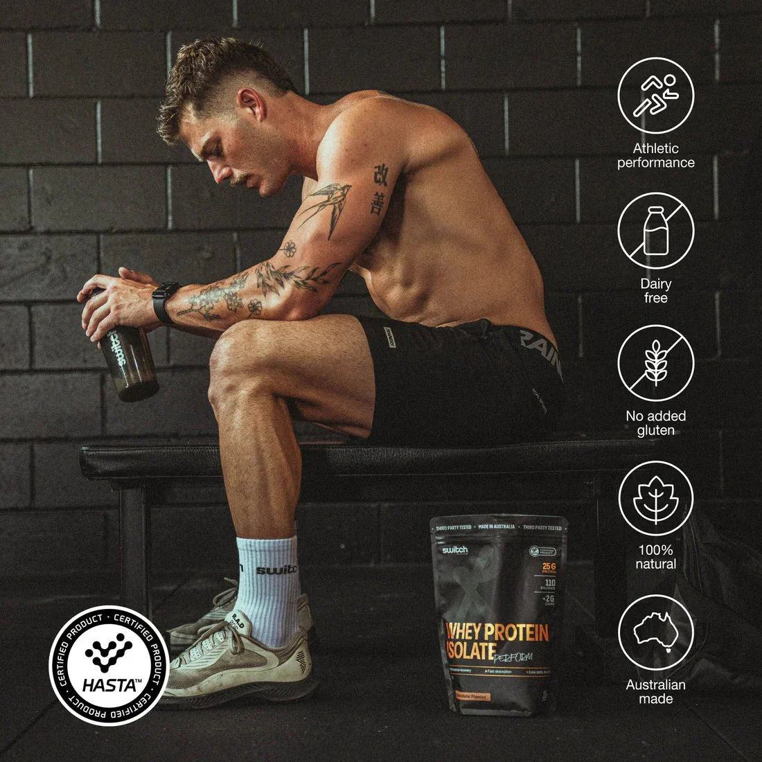 Athletic man resting on bench with Switch Nutrition Perform Whey Protein Isolate - Chocolate 750g beside him in gym setting