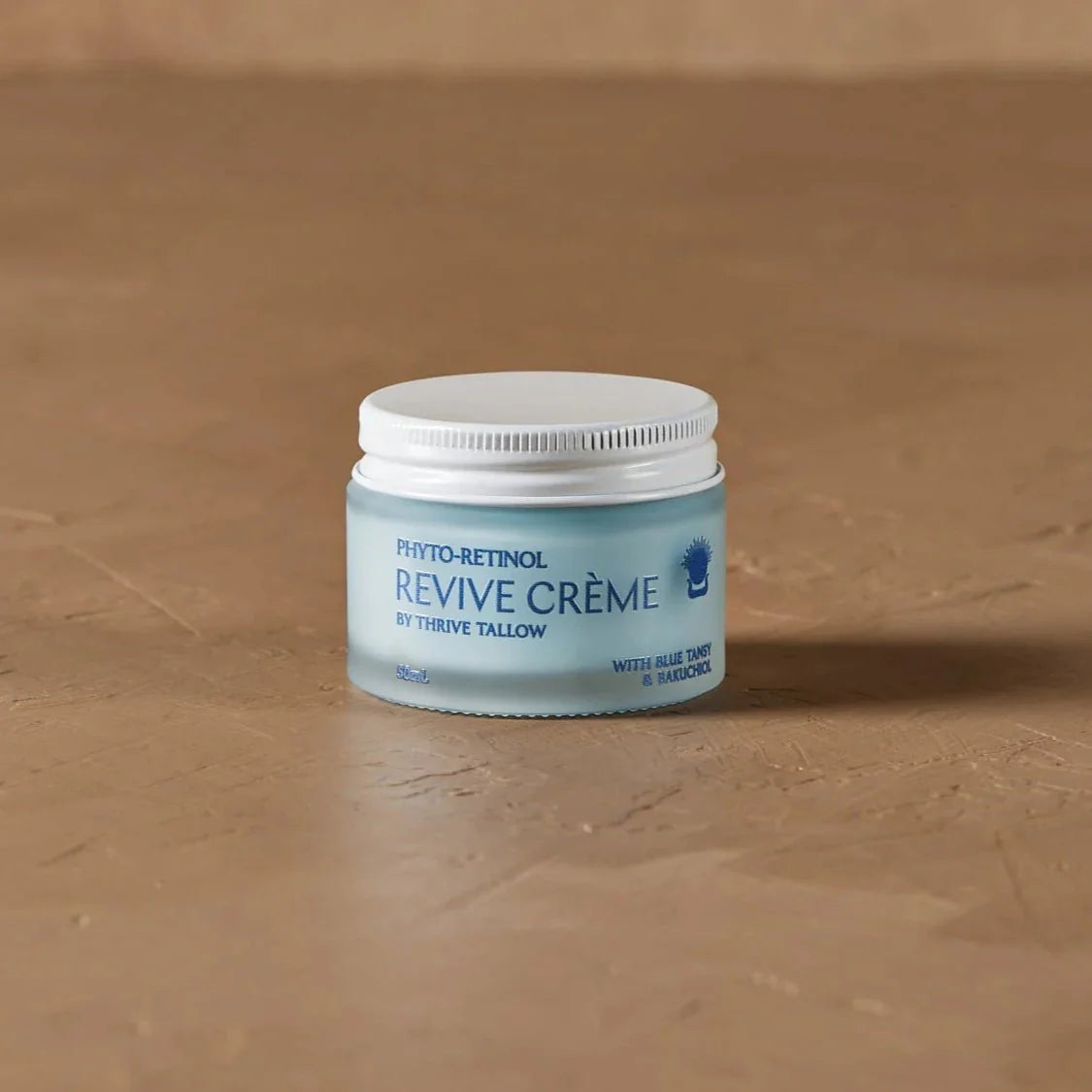 Phyto - Retinol - Revive Creme - 50ml jar by Thrive Tallow on brown textured surface in Body & Beauty collection