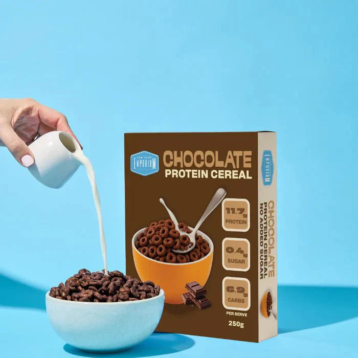 Protein Cereal - Chocolate Flavour - 250g by Low Carb Emporium with milk pouring over bowl of cereal and chocolate pieces