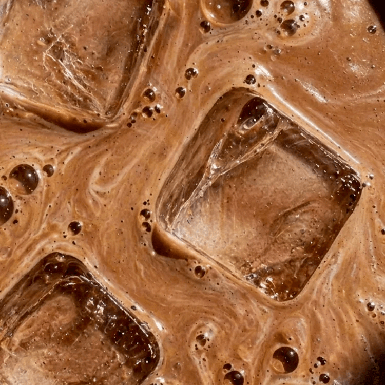 Close-up view of iced chocolate drink with creamy swirls, representing Sodii's Salty Chocolate - 30 Serve Tub, a keto-friendly low carb beverage.