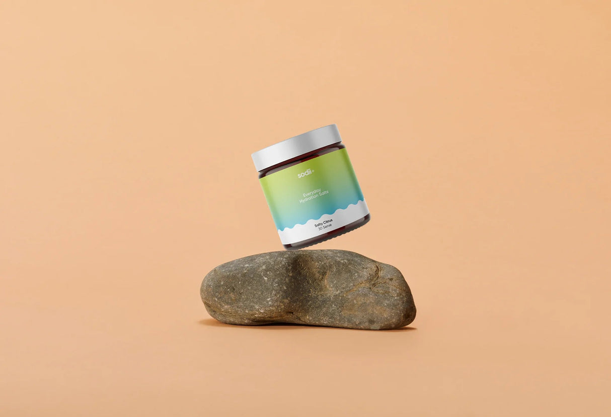 Salty Citrus - 30 Serve Tub by Sodii balanced on smooth stone, part of Drinks Electrolytes New Arrivals collections.