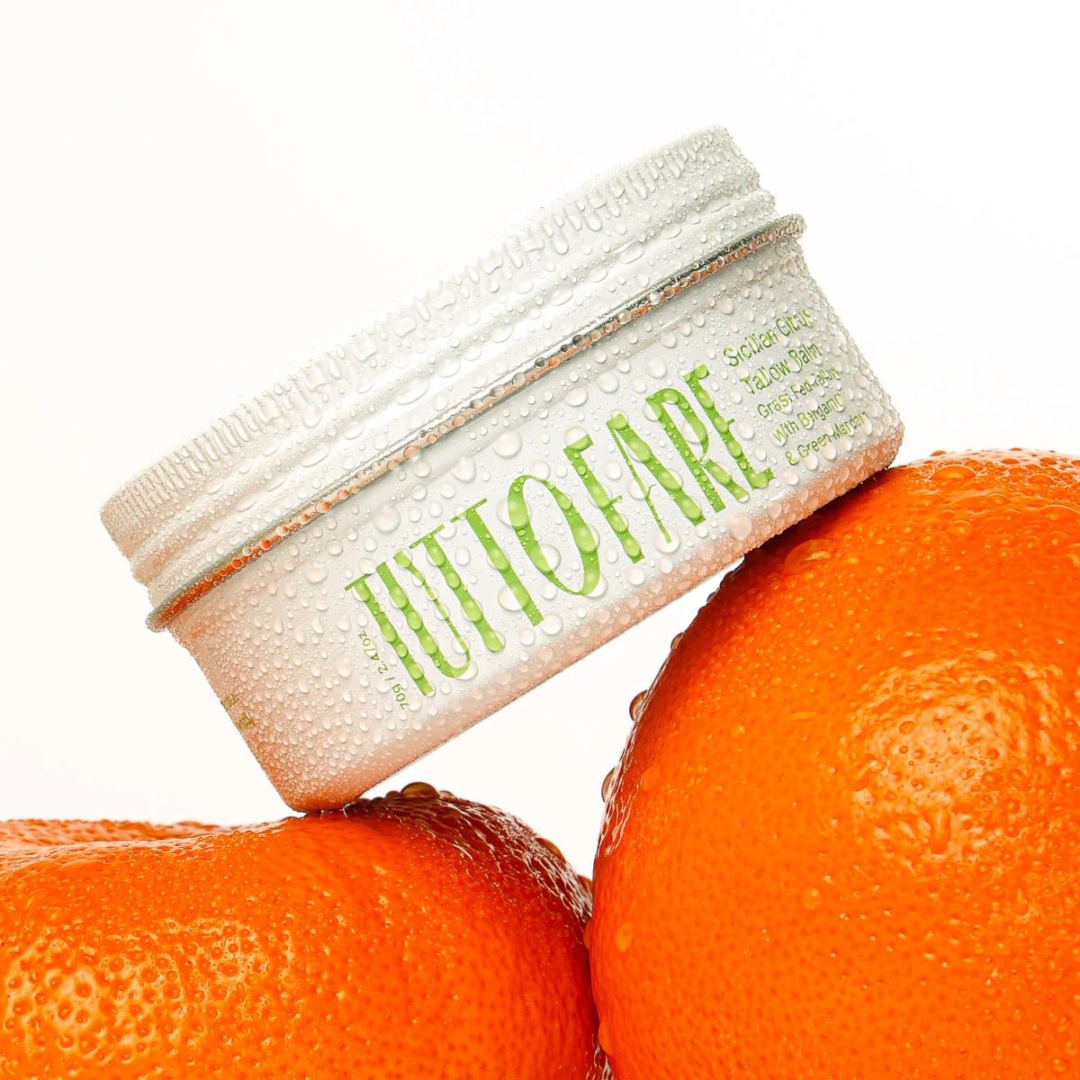 Sicillian Citrus Tallow Balm - 70g by Tuttofare displayed with fresh oranges, highlighting natural skincare and animal fats collections