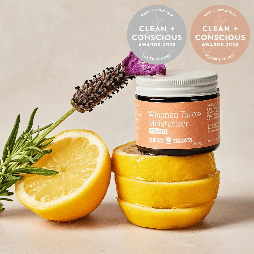 Whipped Tallow Moisturiser - Scented Blend - 70ml by Thrive Tallow displayed with sliced lemon and dried flower.