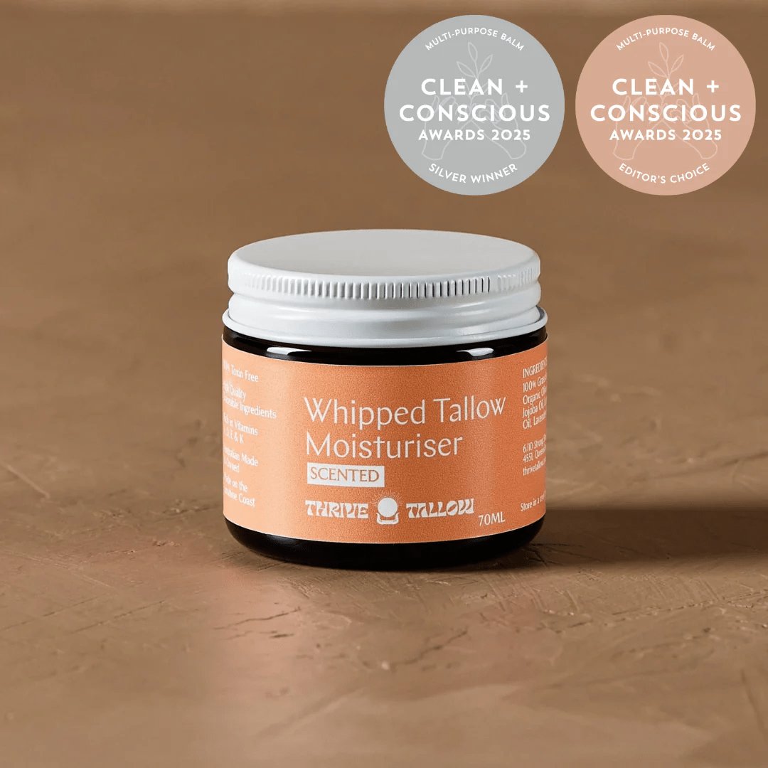 Whipped Tallow Moisturiser - Scented Blend - 70ml by Thrive Tallow in amber jar with white lid on textured brown surface