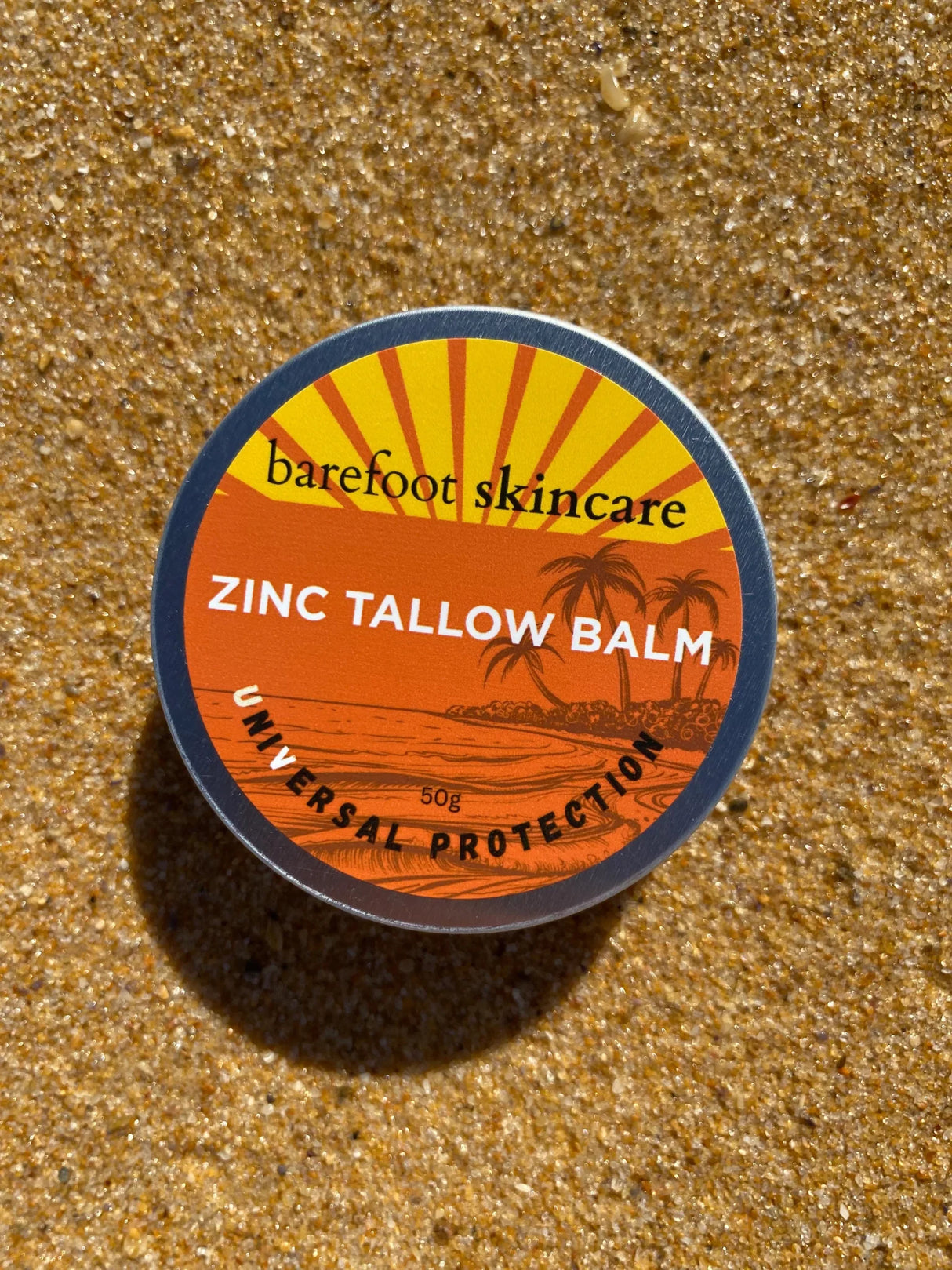 Zinc Tallow Balm - 130g by Barefoot Skincare Co, in vibrant packaging on golden sandy background for skincare use