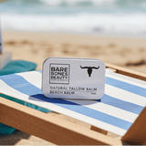 Beach Tallow Balm on beach chair under umbrella