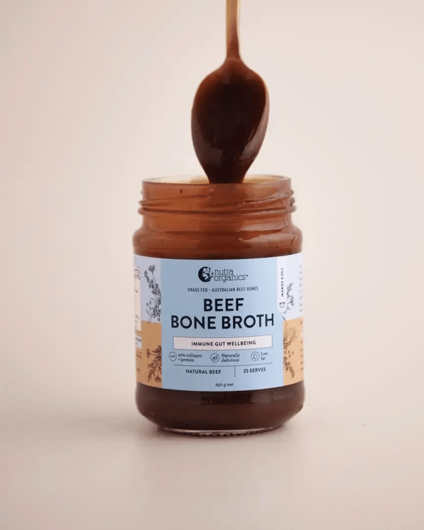 Beef Bone Broth Concentrate - Natural - 250g by Nutra Organics in glass jar with spoon lifting broth above jar
