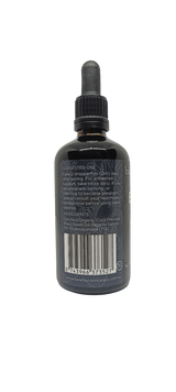 Back label of Black Seed Oil - 100ml with usage instructions, ingredients, barcode, and Barefoot Skincare Co branding in dark glass bottle