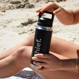 Chief Stainless Steel Water Bottle 800ml in matte black held outdoors, highlighting its durable tumbler design.