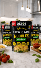 Packaging of Delicious Low Carb Chicken Noodles - 290g by Qetoe displayed in a modern kitchen setting with fresh ingredients nearby.