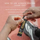 Hands opening a sachet of Hydrate Perform - Kiwi Watermelon - 20 Sticks by Switch Nutrition with usage instructions visible above.