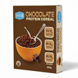 A brown box of Low Carb Emporium Protein Cereal - Chocolate Flavour (250g) shows a bowl of chocolate cereal, spoons, and chocolate squares. Each serve has 11.7g protein, 0.4g sugar, and 6.9g carbs for a low-sugar breakfast option.