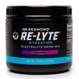 Black container of Redmond Re-Lyte Hydration Electrolyte Drink Mix grape flavor on a white background