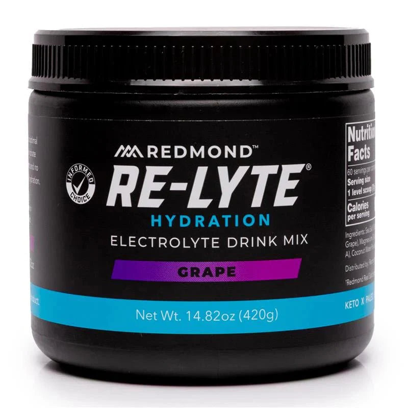 Black container of Redmond Re-Lyte Hydration Electrolyte Drink Mix grape flavor on a white background