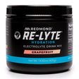 Black container of Redmond Re-Lyte Hydration Electrolyte Drink Mix Grapefruit flavor on a white background