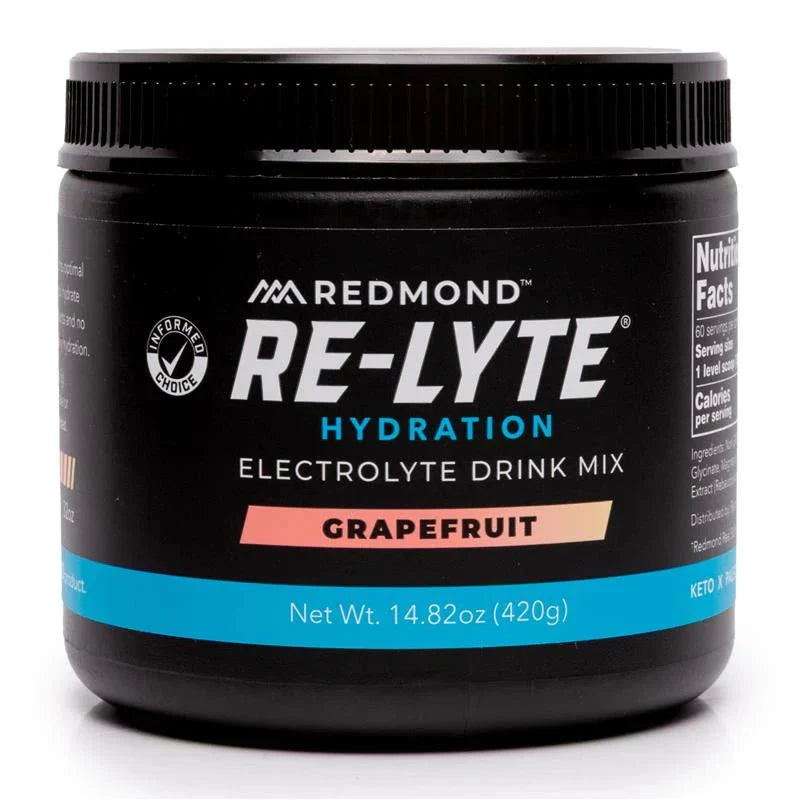 Black container of Redmond Re-Lyte Hydration Electrolyte Drink Mix Grapefruit flavor on a white background