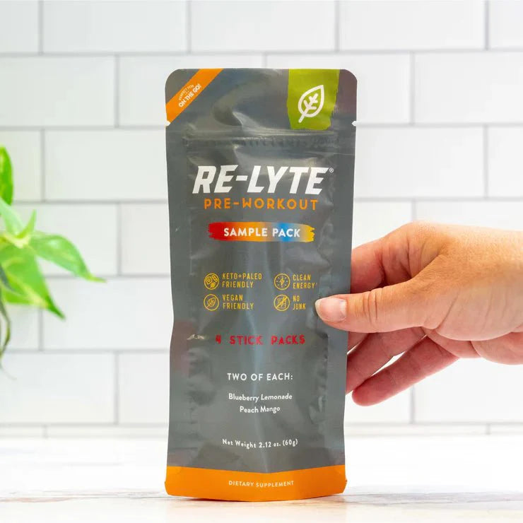 Re-Lyte Pre-Workout Sample Pack - 4 Sticks held, featuring keto and vegan-friendly clean energy pre-workout supplement.