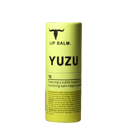 Yuzu Lip Balm - 7g by Bare Bones Beauty in yellow tube with black text and logo showcasing natural nourishing lip care